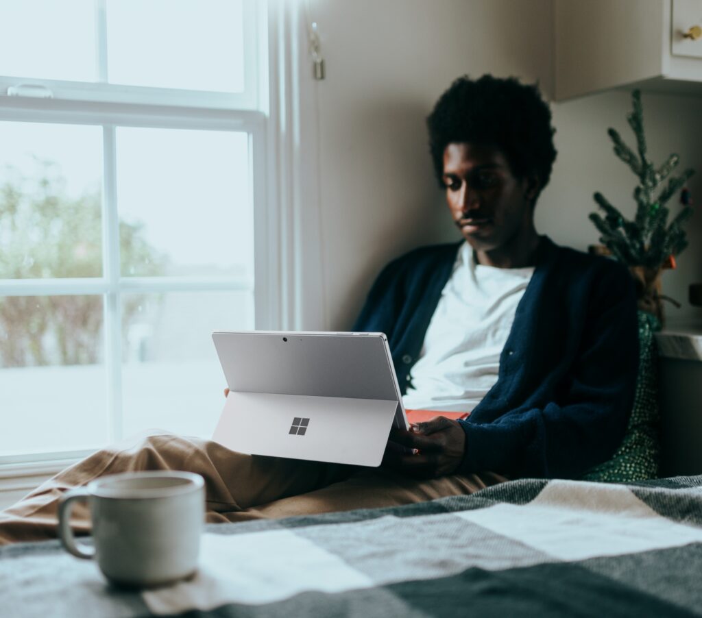 Patient reading article on computer at home